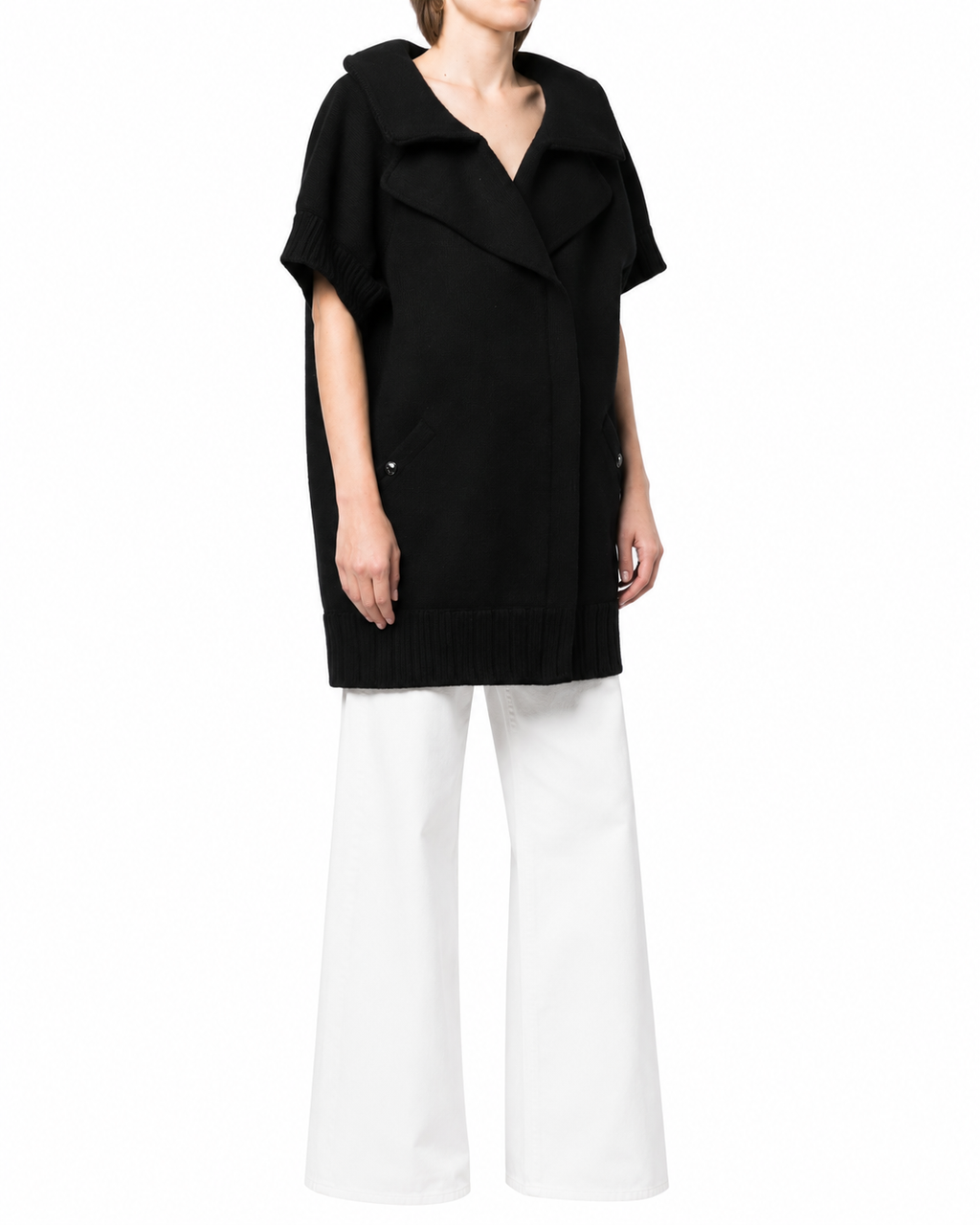 Black Chanel short-sleeved knit gilet, a stylish blazer or jacket with a fitted design and classic logo detailing.