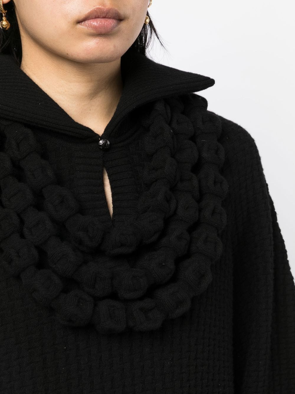Black textured knit dress with a collared neckline by Chanel, showcasing elegant, tailored fashion for sophisticated style.