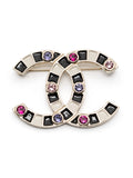 Chanel Crystal Enamel Stripe Brooch featuring colorful stripes and sparkling crystals on a metal pin back.