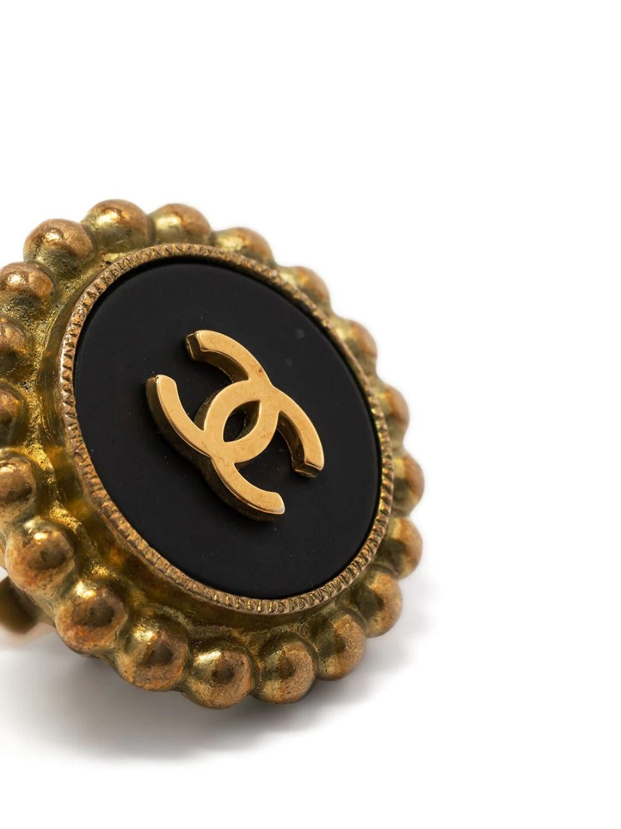 Gold-tone Chanel clip-on button earrings featuring the iconic CC logo detailing on the front.