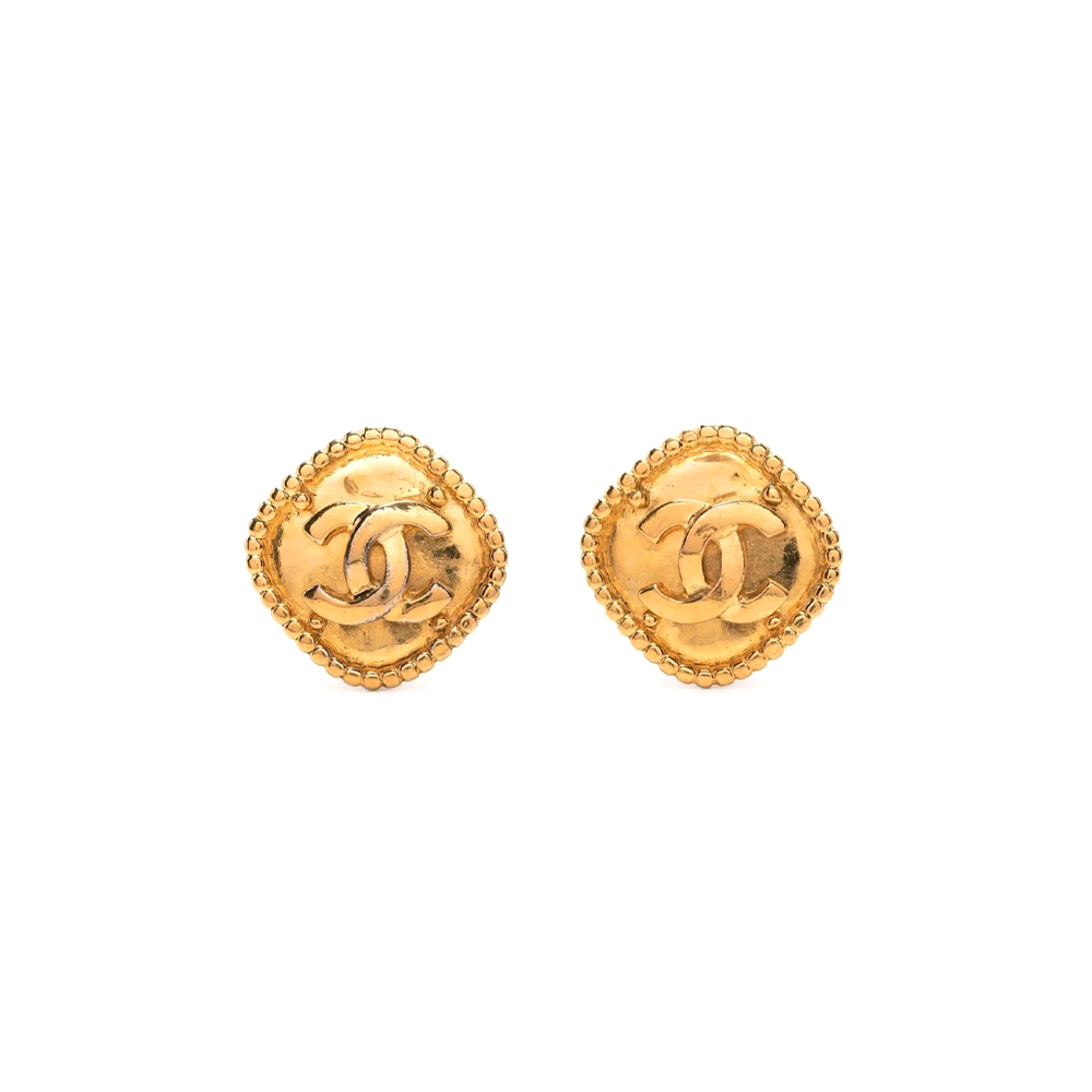 Gold-tone rhombus clip-on earrings by Chanel featuring sleek geometric design and polished finish.