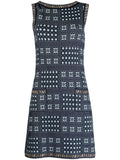 Navy and white Chanel winter knit dress with long sleeves and cozy knit texture, stylish for cold weather wear.
