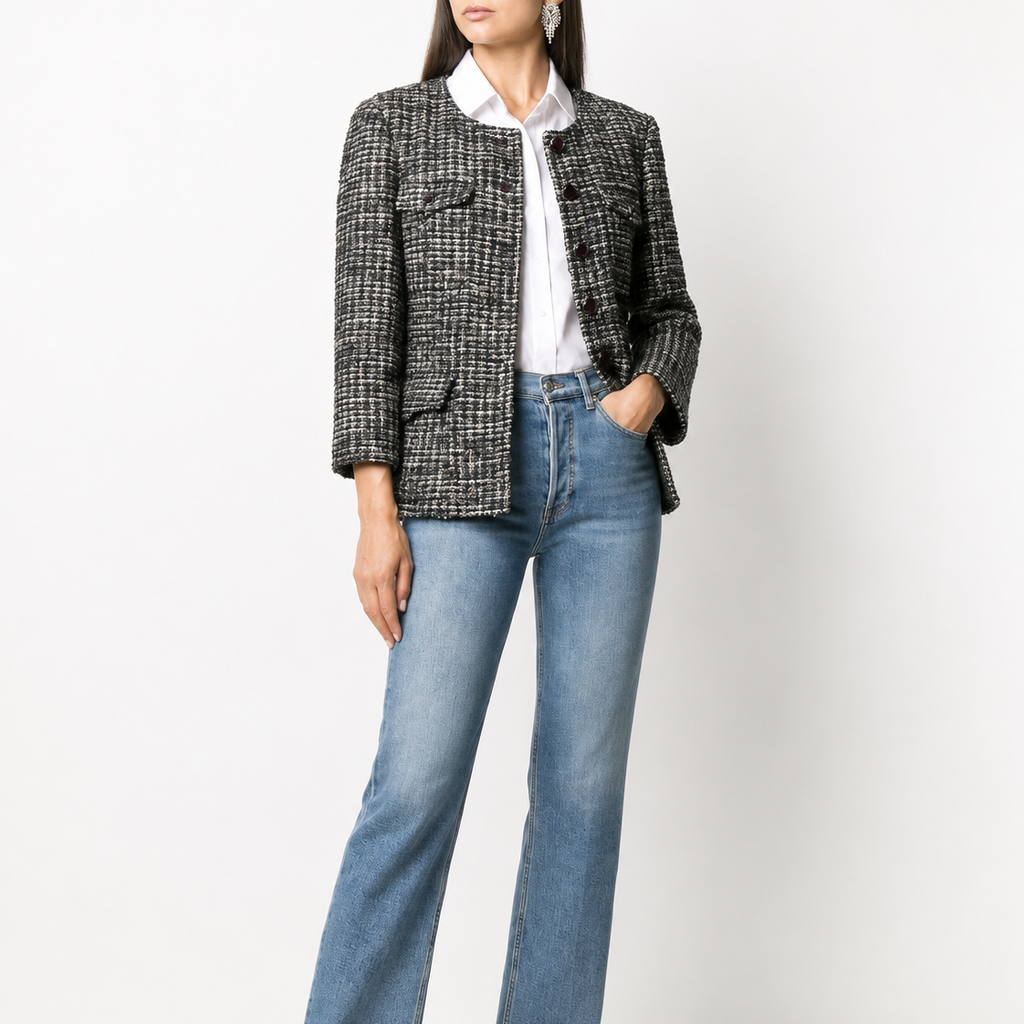 Navy bouclé tweed Chanel blazer with a classic tailored fit and textured fabric, styled with a notched collar and front buttons.