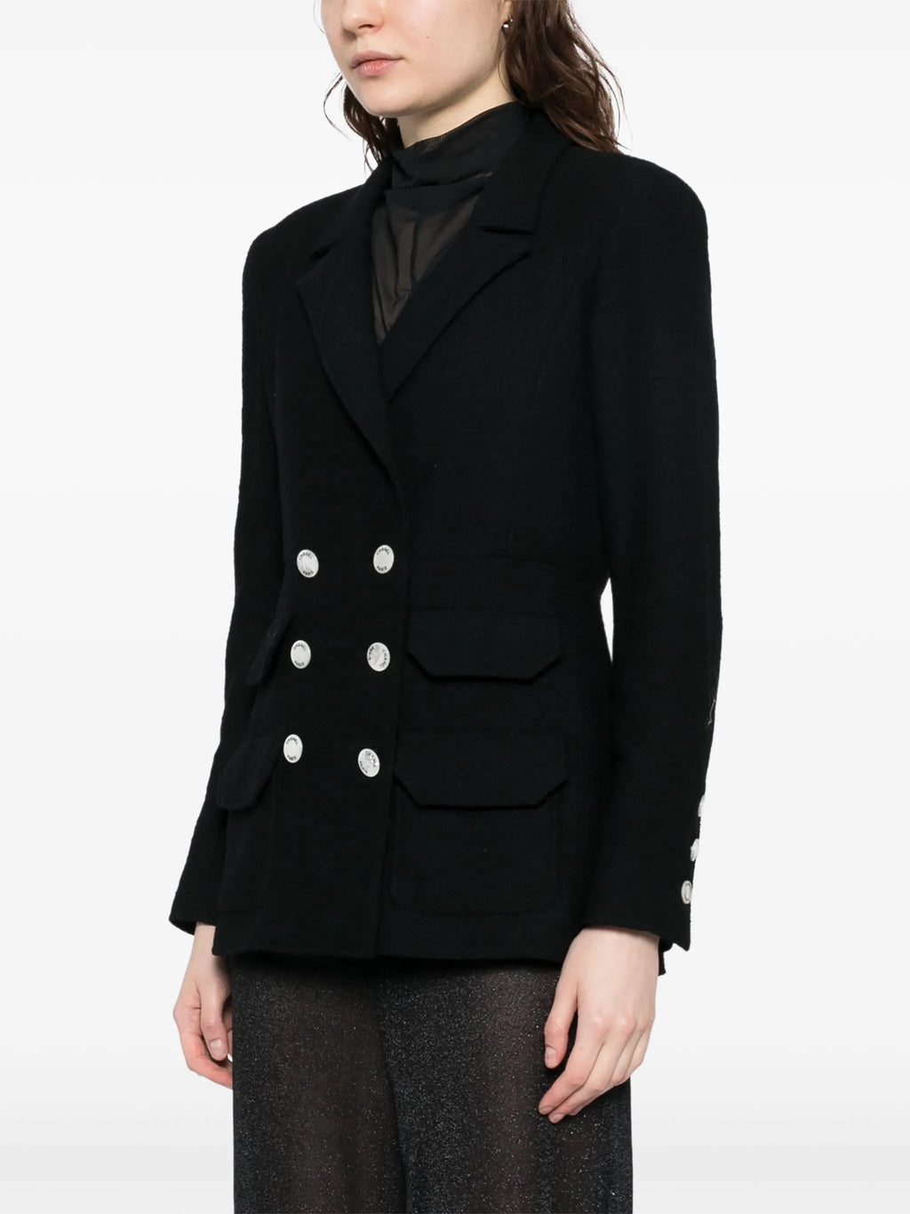 Navy double-breasted Chanel blazer with structured lapels and tailored fit, shown on a mannequin.