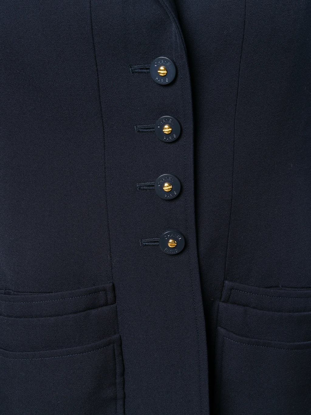 Navy layered pockets blazer by Chanel featuring tailored fit, structured design, and classic lapel, suitable for sophisticated style.