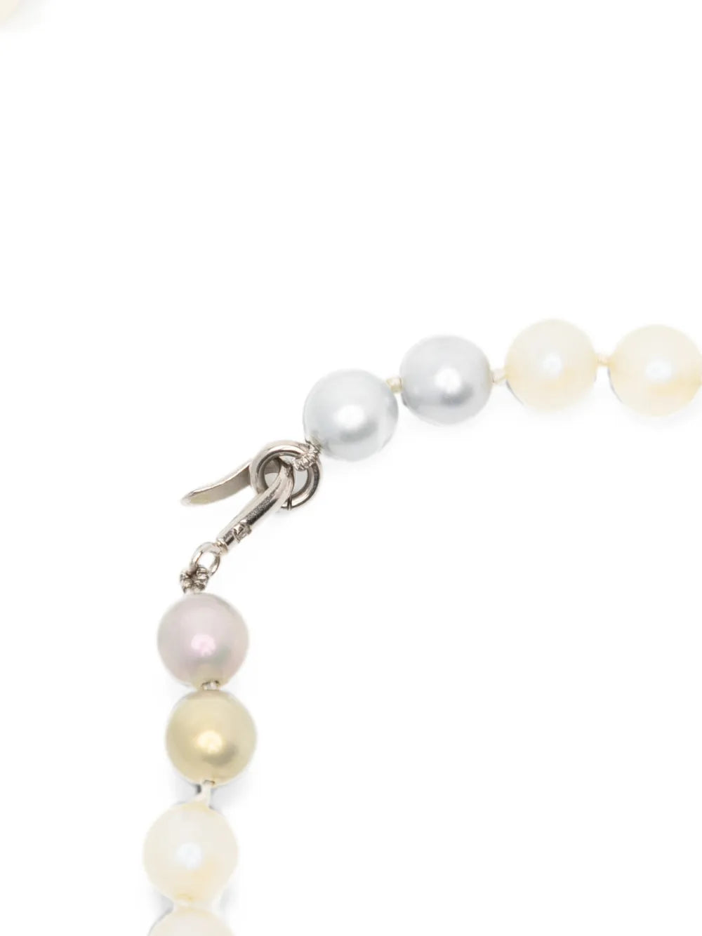 Close-up of a Chanel long pearl sautoir necklace featuring elegant white pearls and a classic design.