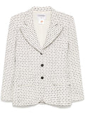 Chanel monochrome blazer in textured black and white tweed, tailored blazer with classic collar and structured fit.