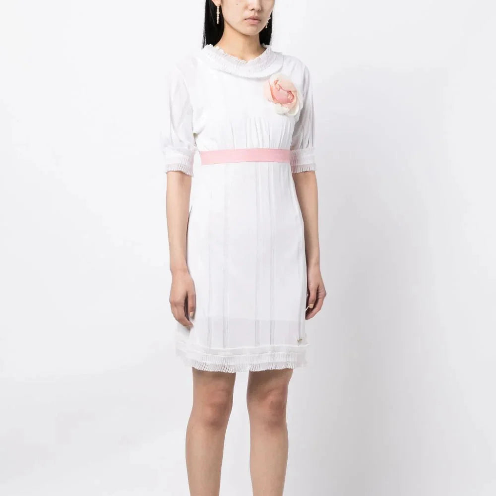 White Chanel Camelia Babydoll Dress with delicate fabric and feminine silhouette, perfect for elegant occasions.