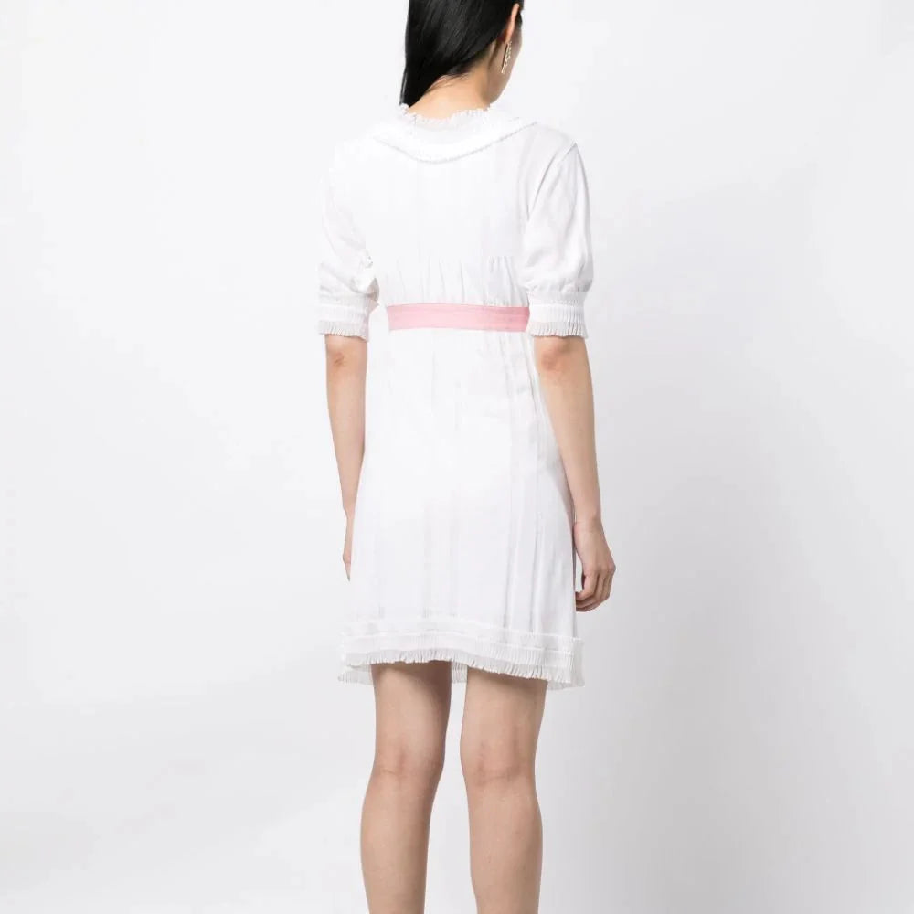 White Chanel Camelia Babydoll Dress with delicate fabric and floral details, perfect for elegant and feminine style.
