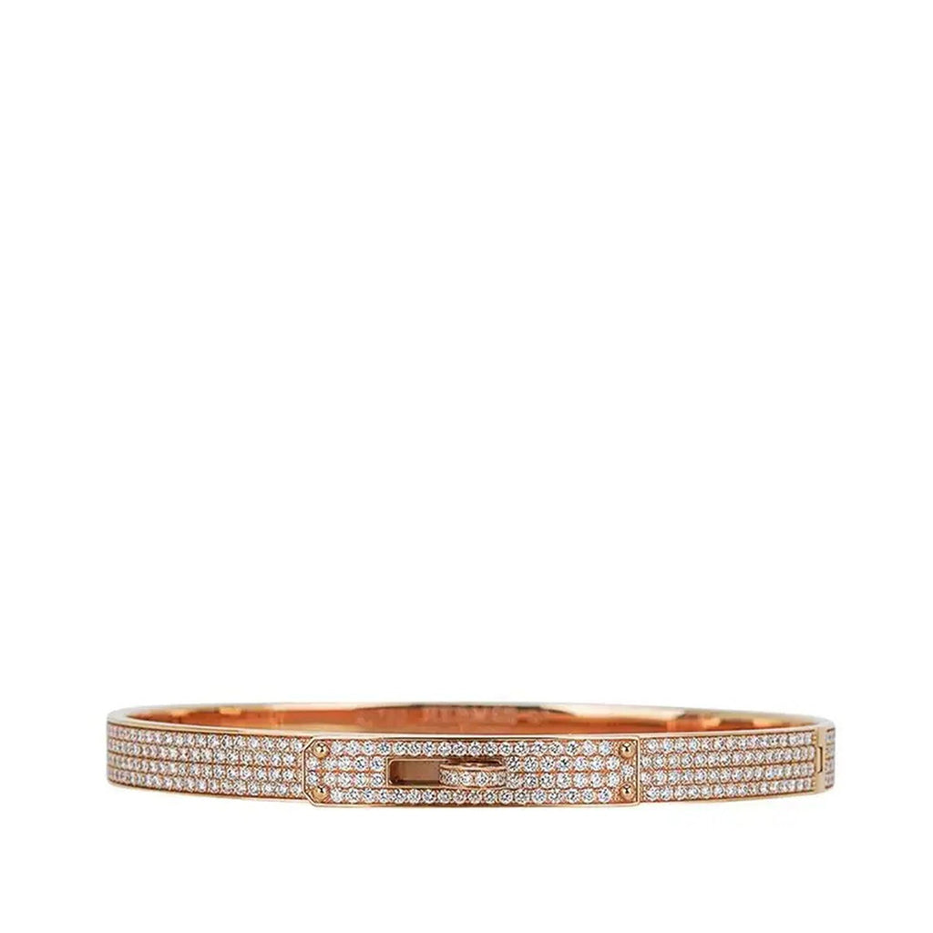 Hermès rose gold diamond Kelly bracelet with intricate design, featuring sparkling diamonds on a luxurious bracelet.