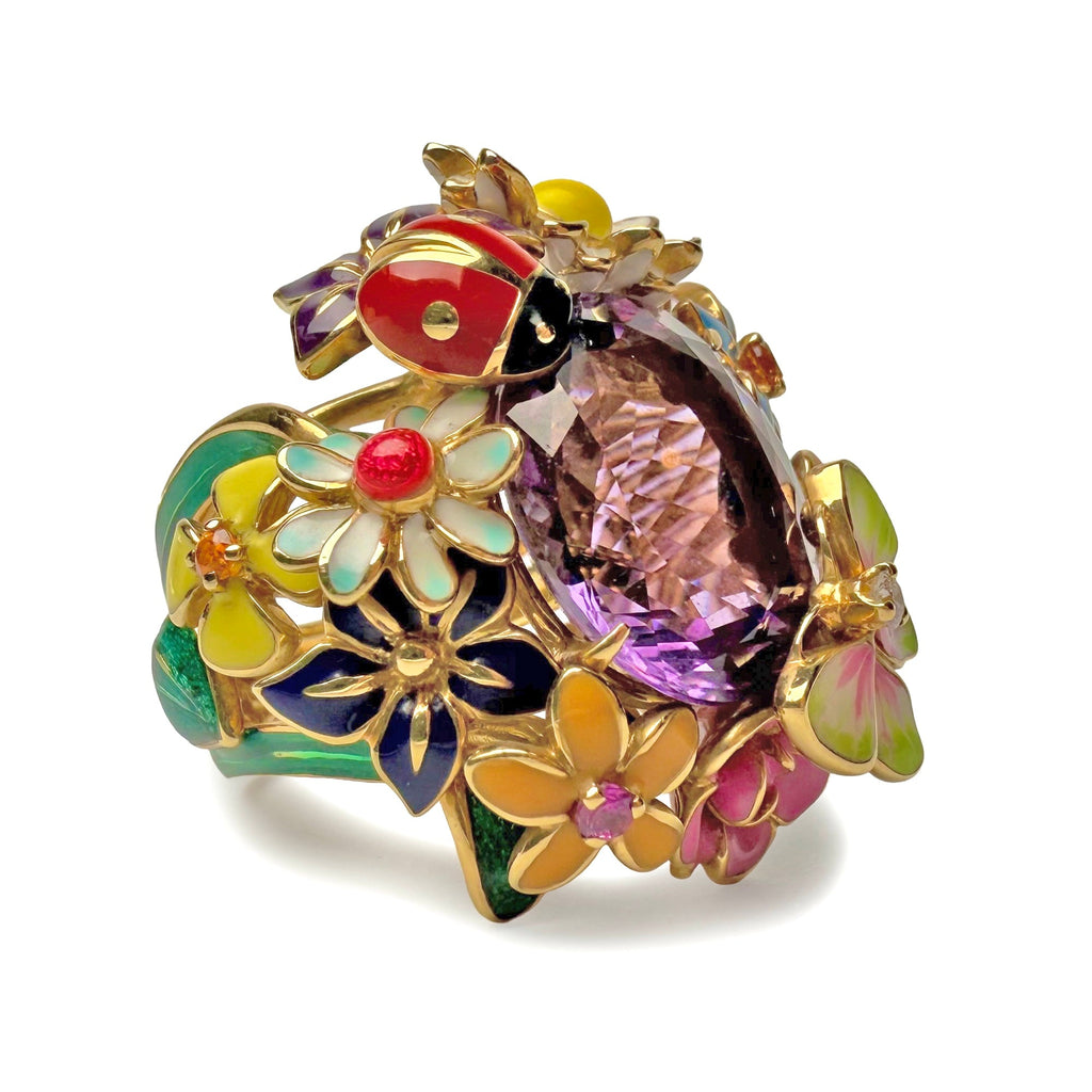 Dior Diorette ring featuring a sleek gold band and intricate design, displayed from a front angle.