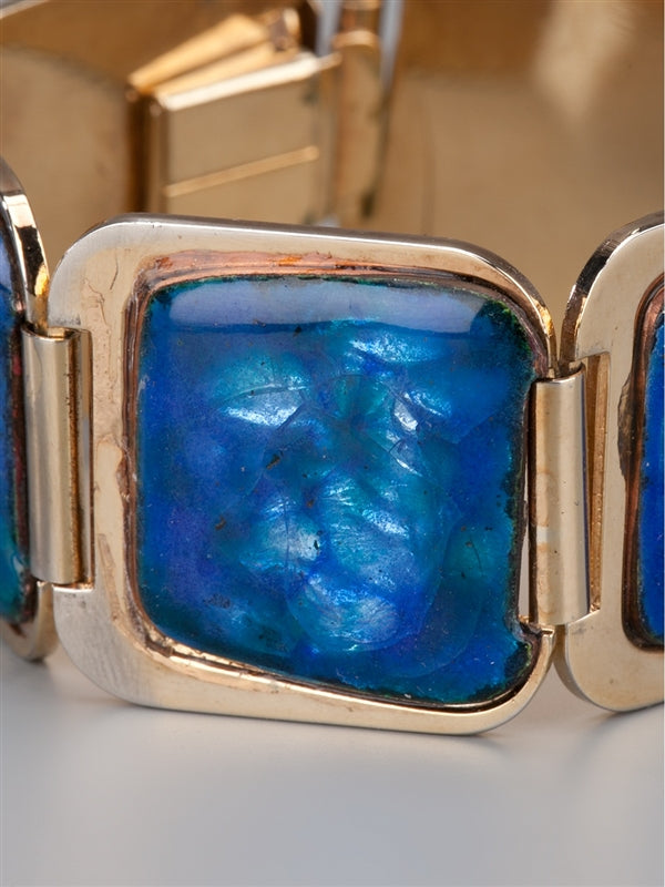 Vintage 1970s bracelet from Vintage Finds featuring retro metal links and intricate design on a neutral background.