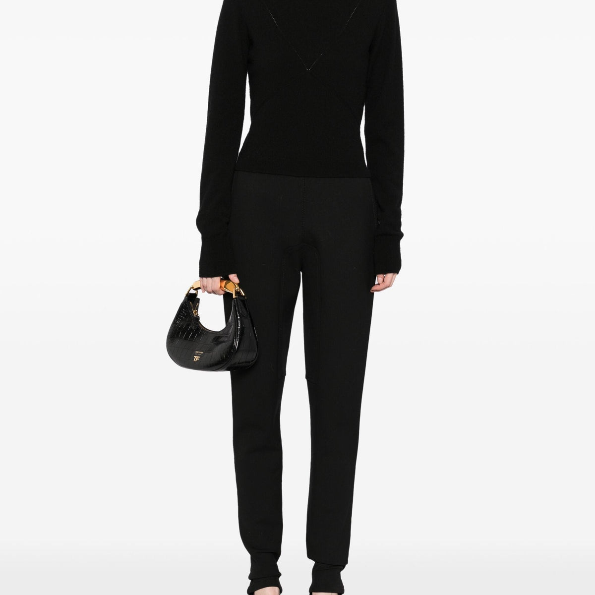Hermès black riding trousers with a tailored fit, featuring sleek fabric and classic styling for equestrian or casual wear.