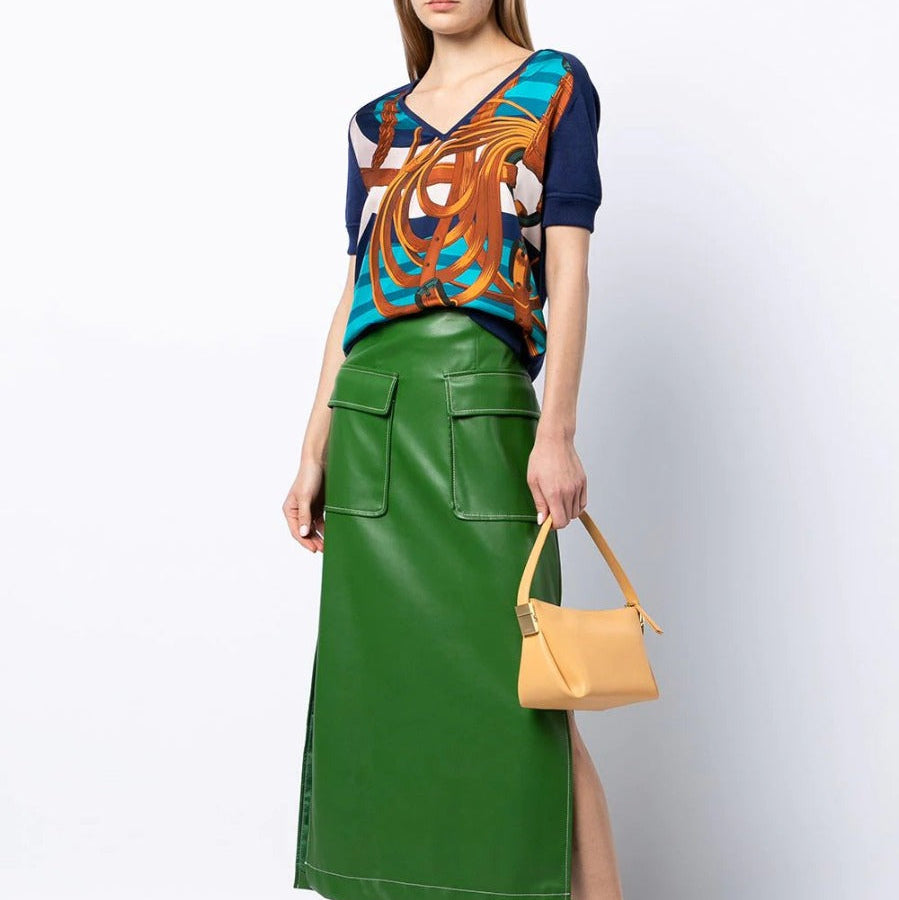 Hermès navy bridle print silk top displayed on a hanger, showcasing elegant pattern and smooth fabric in a stylish women's top.