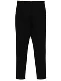 Hermès black riding trousers with tailored fit, featuring sleek fabric and classic design suitable for equestrian or casual wear.