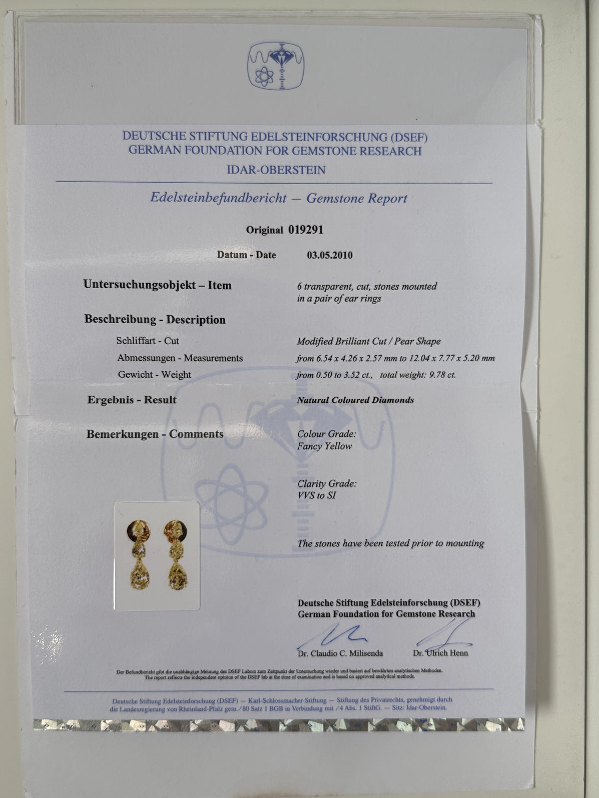 Bucherer fancy yellow diamond earrings featuring sparkling yellow diamonds set in elegant earrings design