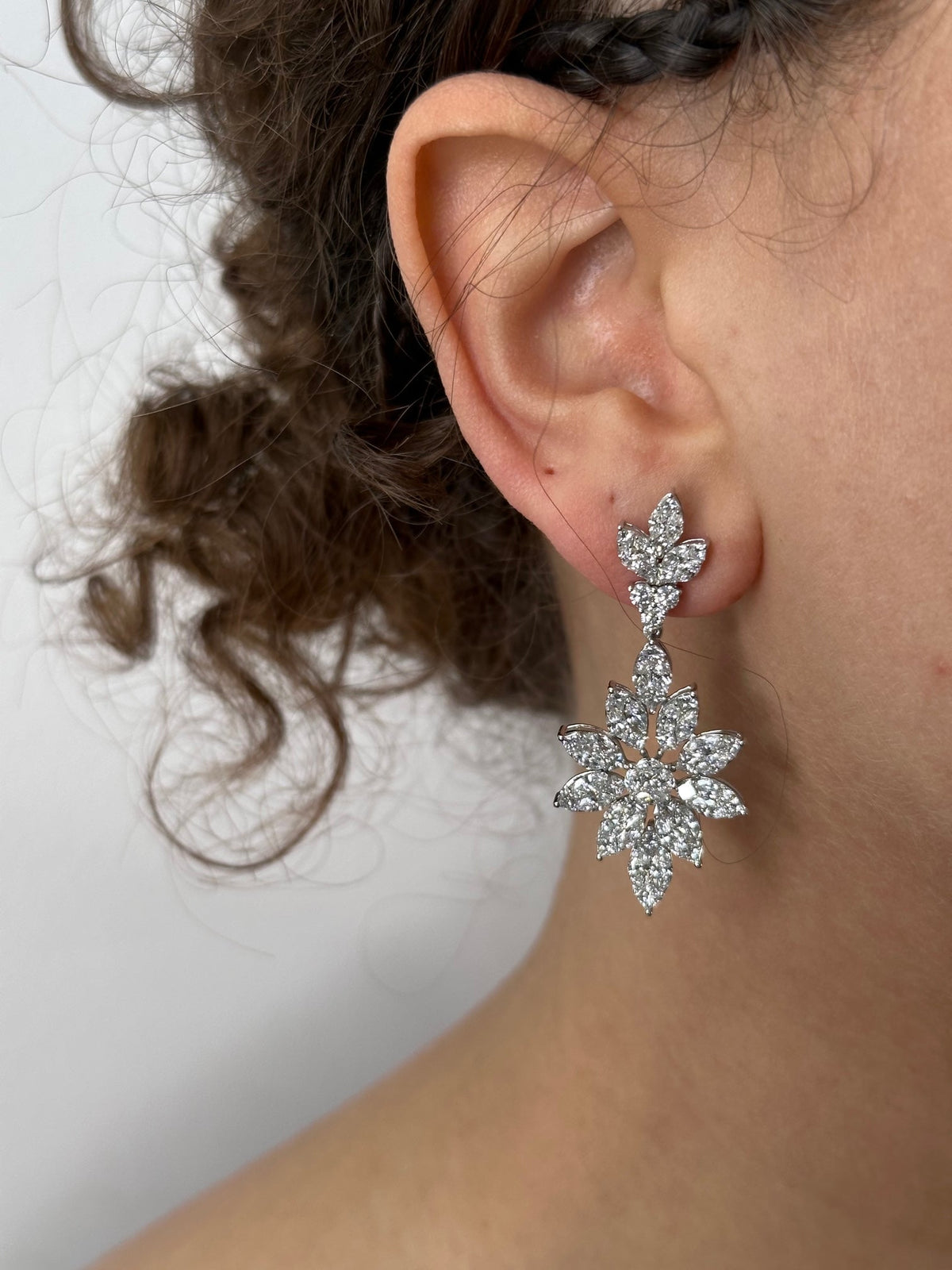 Korloff diamond earrings featuring sparkling gemstones set in elegant metal, designed for a luxurious jewelry look.