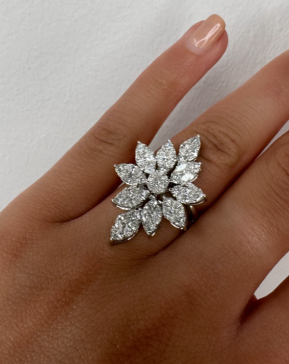 Korloff diamond ring featuring a sparkling central diamond set in a sleek band, showcasing elegant jewelry design.