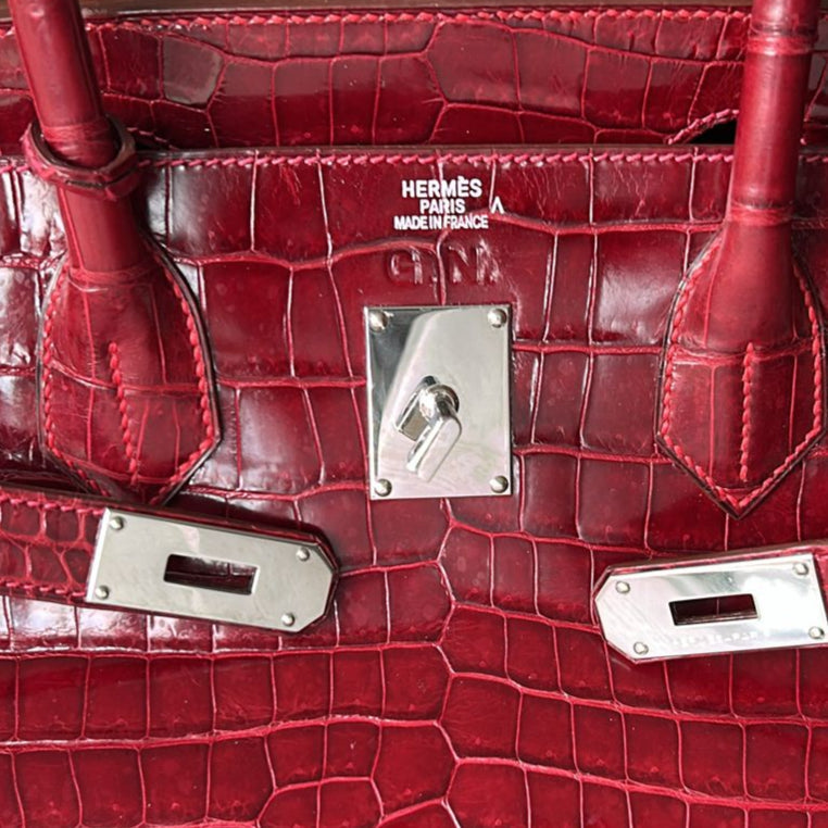 Hermès JPG Shoulder Birkin 42 Red Porosus PHW leather bag with gold hardware, featuring a sleek design and structured silhouette.