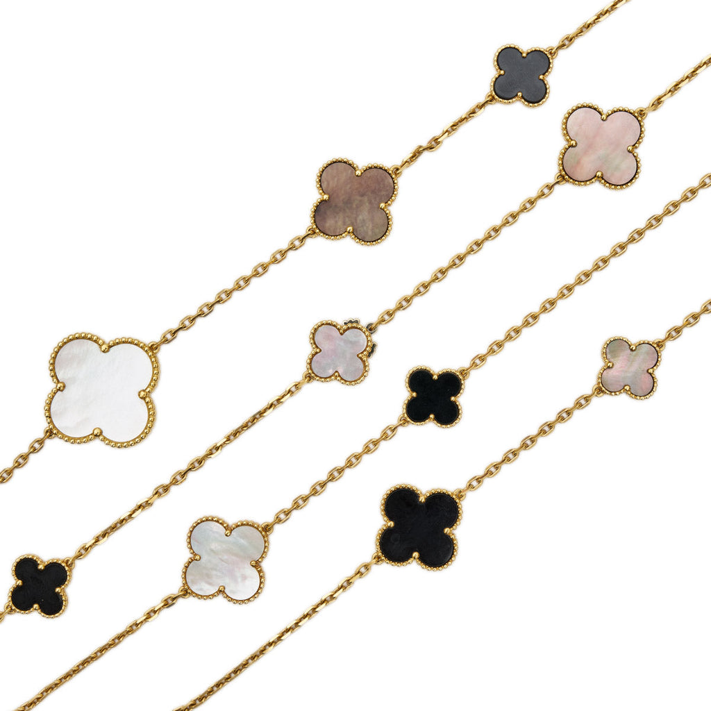 Van Cleef & Arpels Magic Alhambra long necklace featuring gold clover motifs and delicate chain detailing.