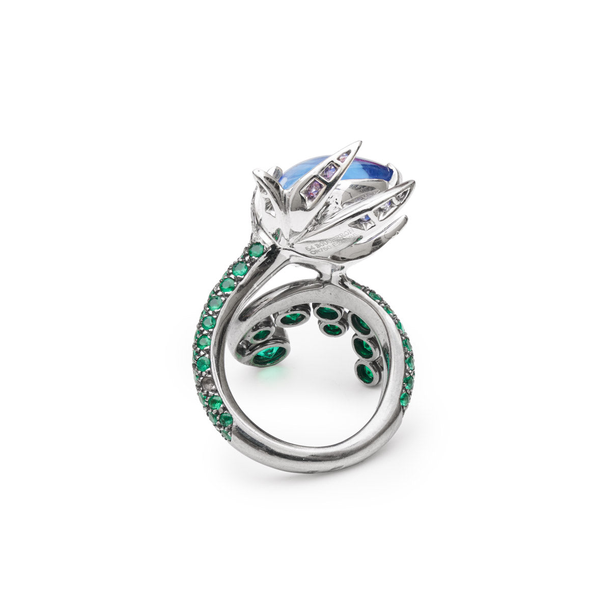 Boucheron sapphire and emerald ring showcasing a gold band with vibrant blue sapphires and green emeralds in an elegant jewelry design