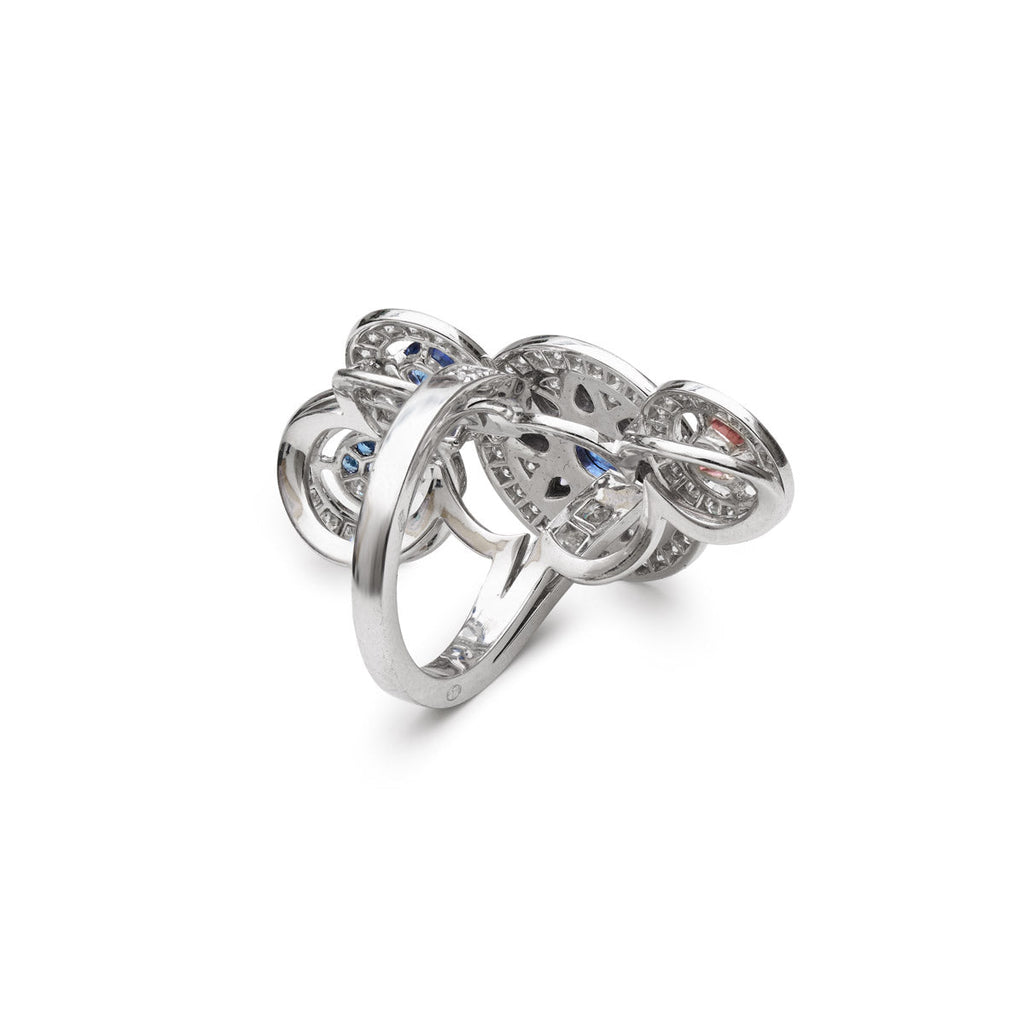 Boucheron Shéhérazade ring showcasing intricate gold and gemstone detailing, elegant jewelry piece on a neutral background