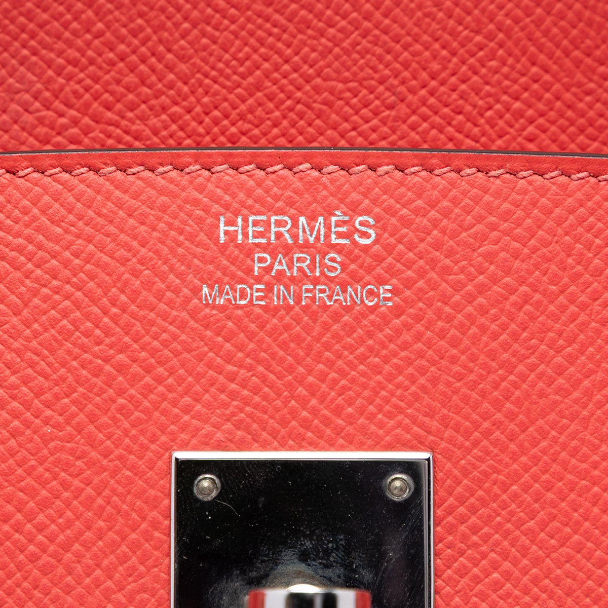 Hermès Birkin 35 Retourne Epsom PHW top handle bag in light beige with gold hardware, showcased from a side angle.