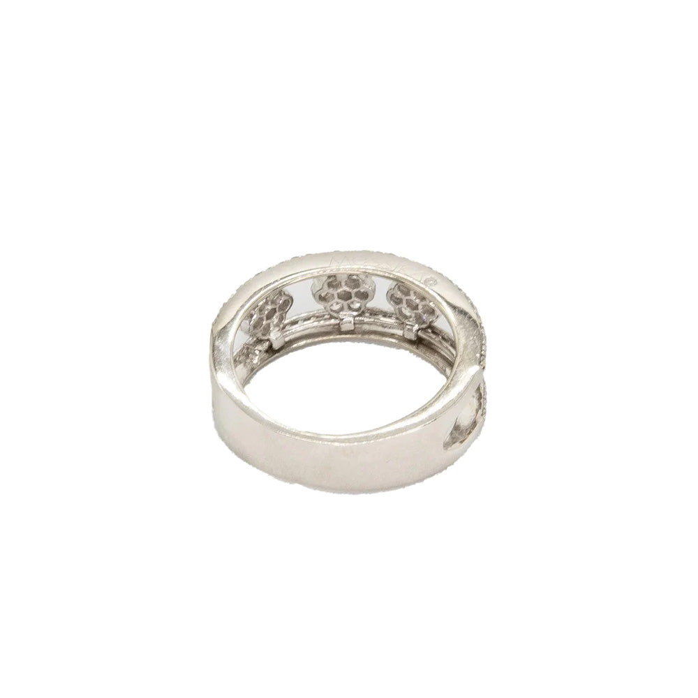 Messika Diamond Floral Ring with intricate floral design and sparkling diamonds, showcasing elegant jewelry craftsmanship.