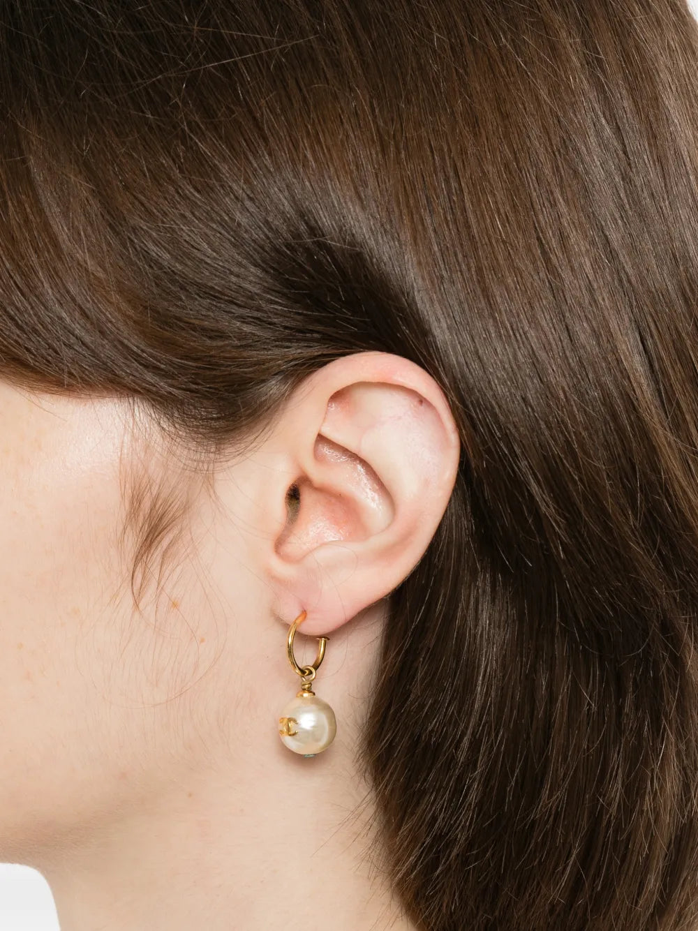 Chanel Pearl CC earrings featuring classic pearl and interlocking CC logo design, stylish jewelry accessory for women