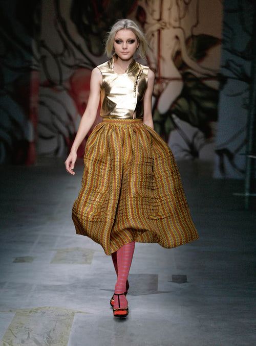 Prada sleeveless golden leather vest with button details, stylish top featuring a sleek, modern design.