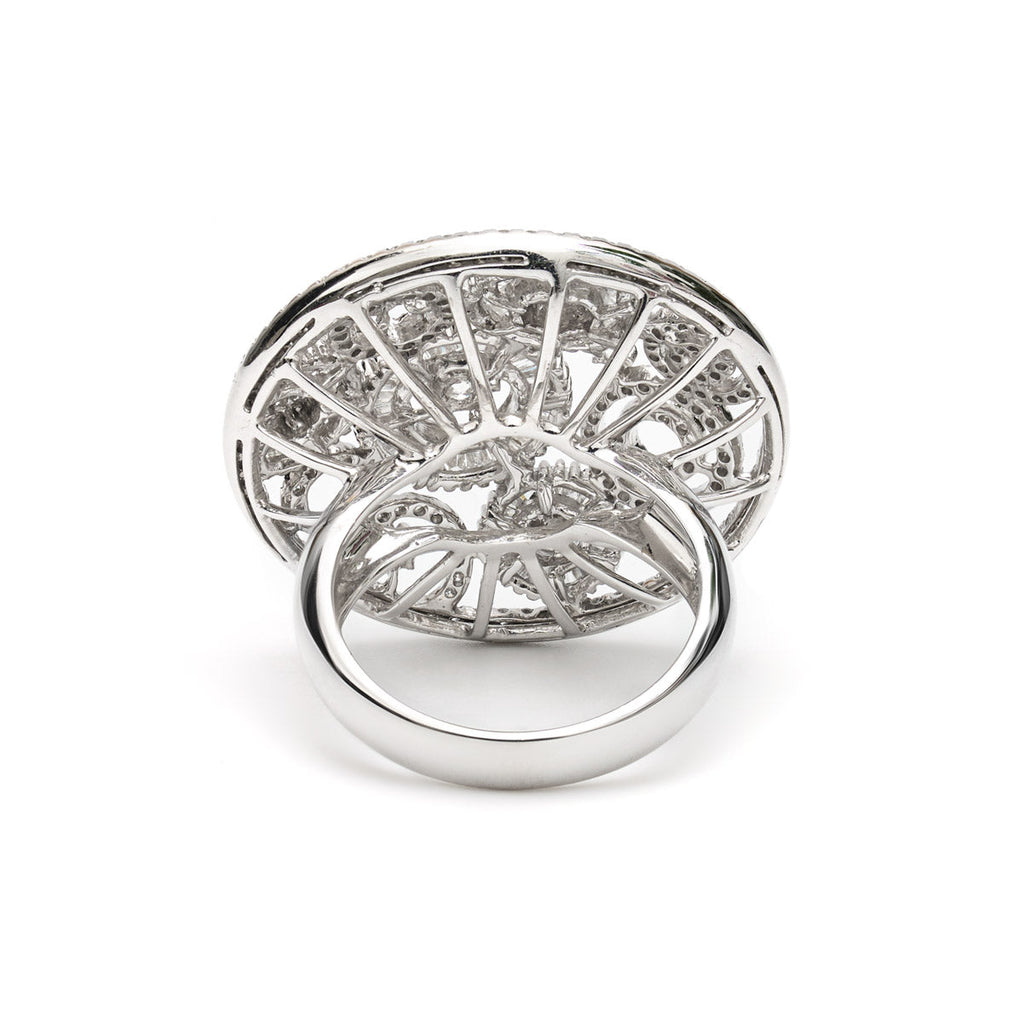 Vintage Finds round ornate diamond ring with intricate detailing and sparkling diamonds, showcasing elegant jewelry design.
