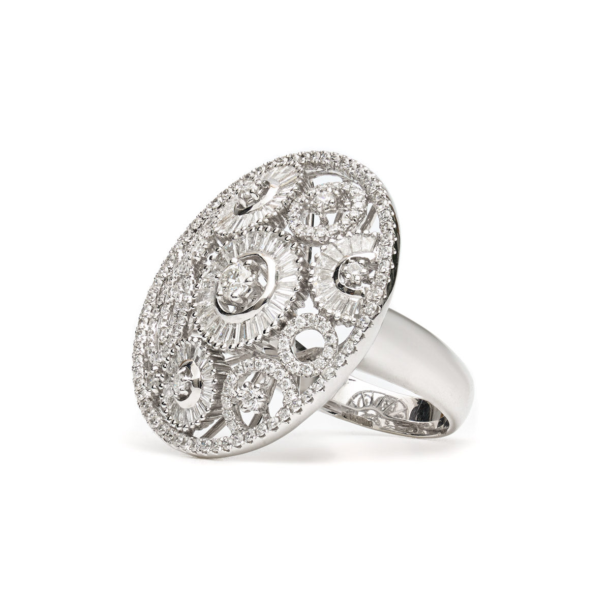 Vintage Finds round ornate diamond ring featuring intricate metalwork and sparkling diamonds, showcasing elegant jewelry design.