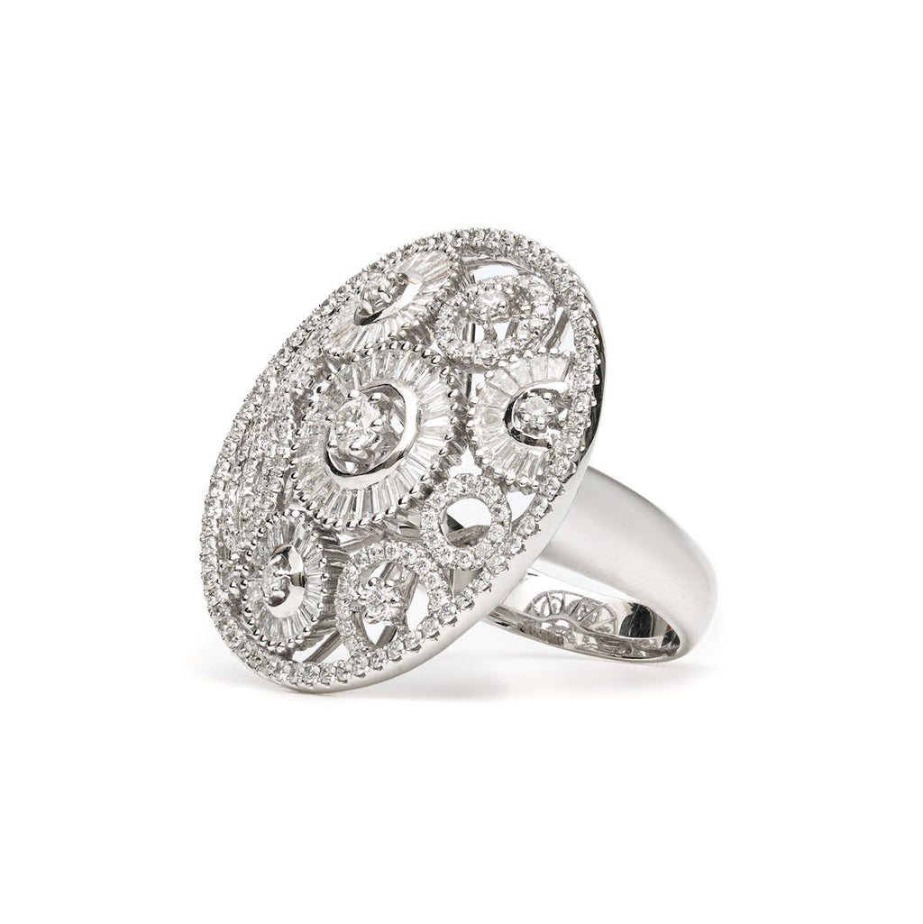 Vintage Finds round ornate diamond ring featuring intricate metalwork and sparkling diamonds, showcasing elegant jewelry design.