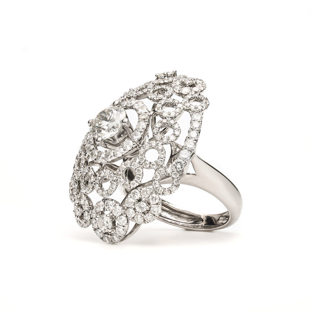 Vintage Finds ornate cluster diamond ring featuring multiple sparkling diamonds set in a detailed gold band.