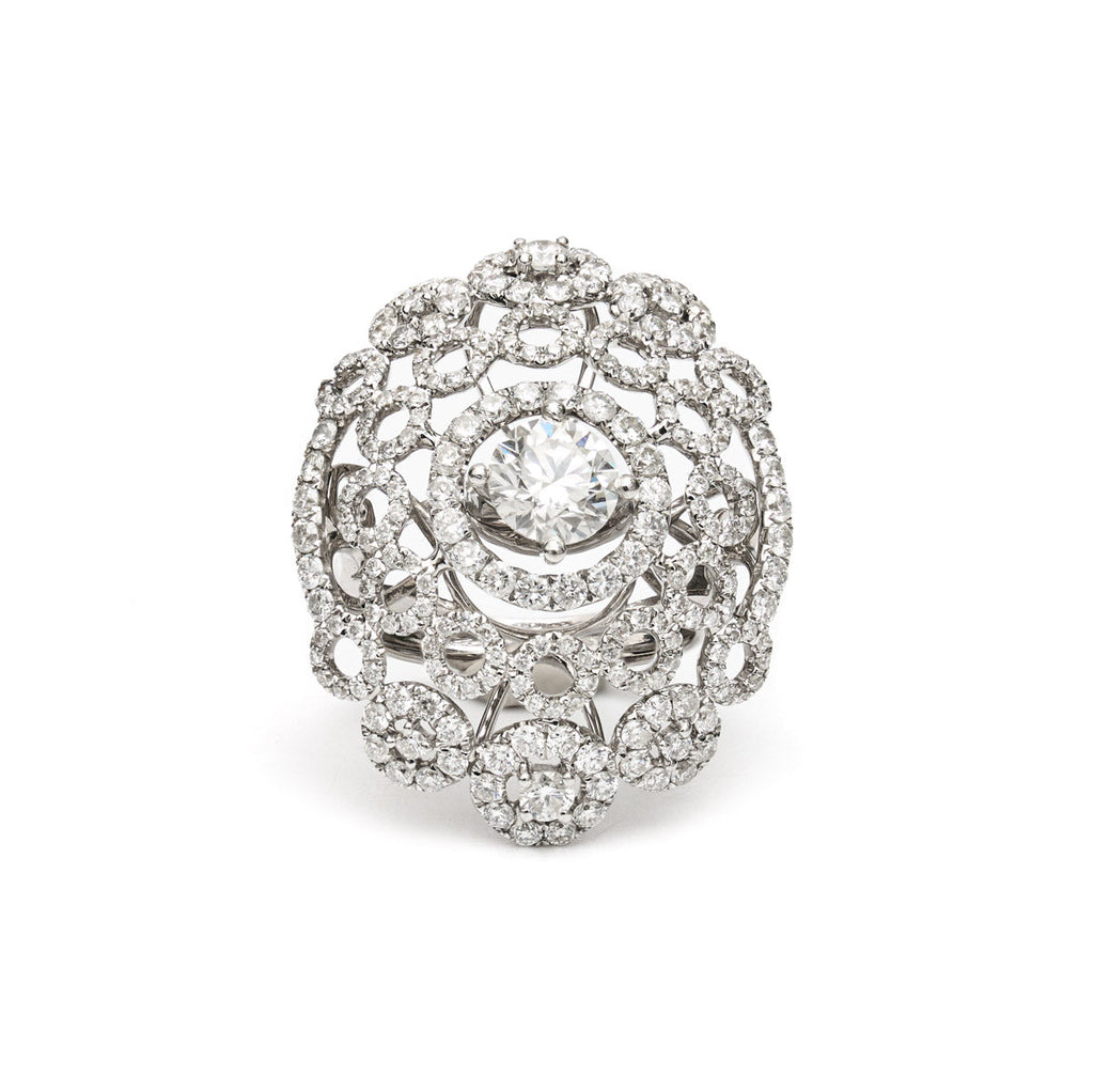 Vintage Finds ornate cluster diamond ring featuring a detailed design with sparkling diamonds and a gold band.