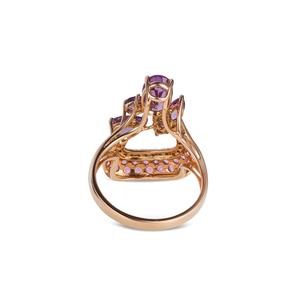 Vintage Finds purple sapphire ring featuring a vibrant purple gemstone set in a classic ring design.