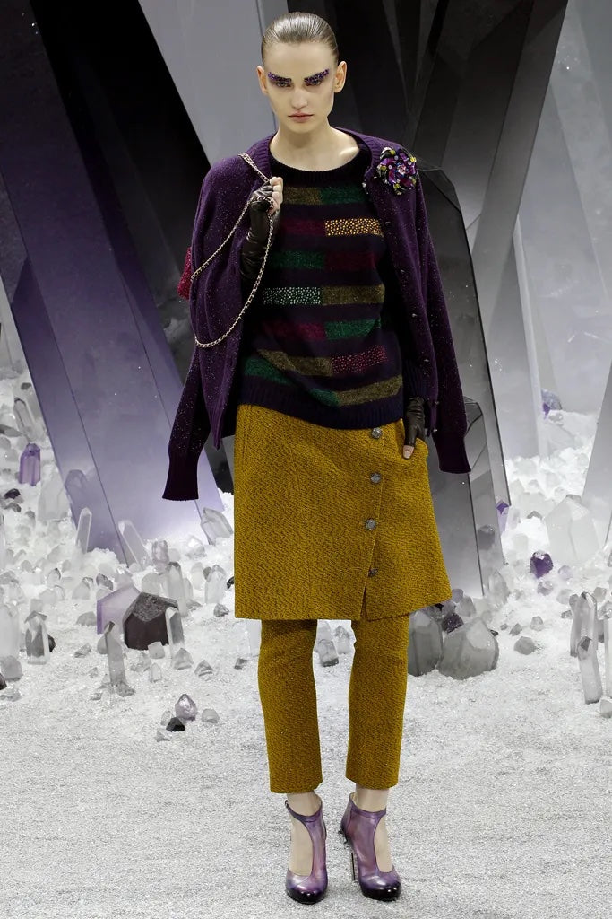 Chanel 2012 rhinestone striped jumper top with bold pattern and sparkling embellishments, stylishly displayed on a hanger.