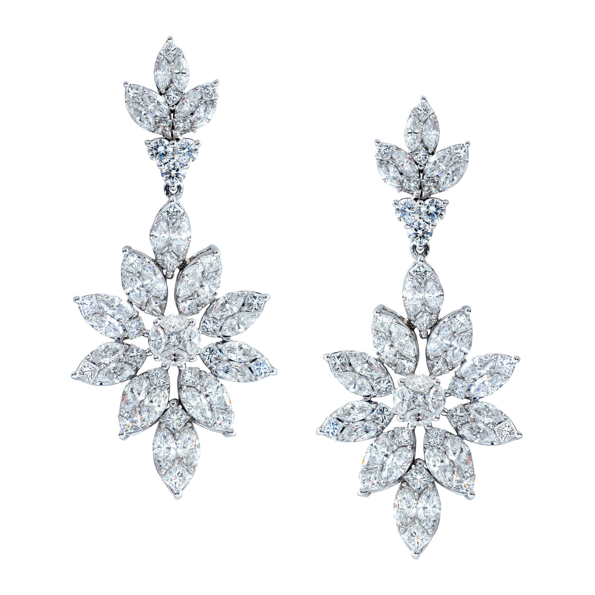 Korloff diamond earrings with sparkling gemstones set in elegant silver or gold, showcasing intricate craftsmanship and timeless style.