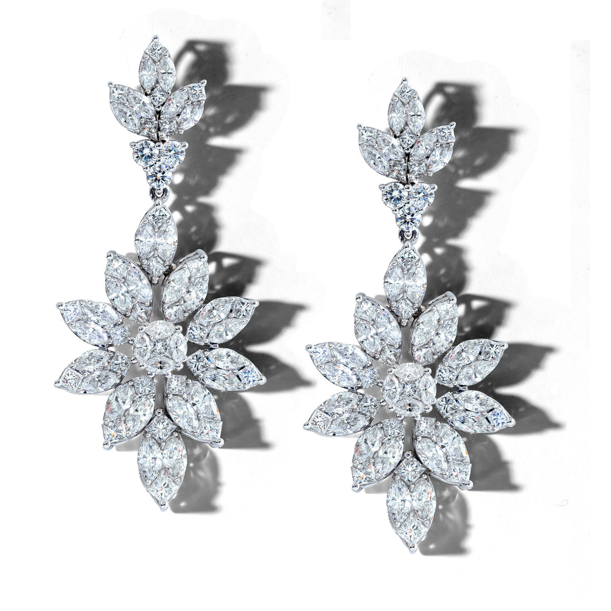 Korloff diamond earrings with sparkling gemstones and elegant design, showcasing fine craftsmanship and luxury.