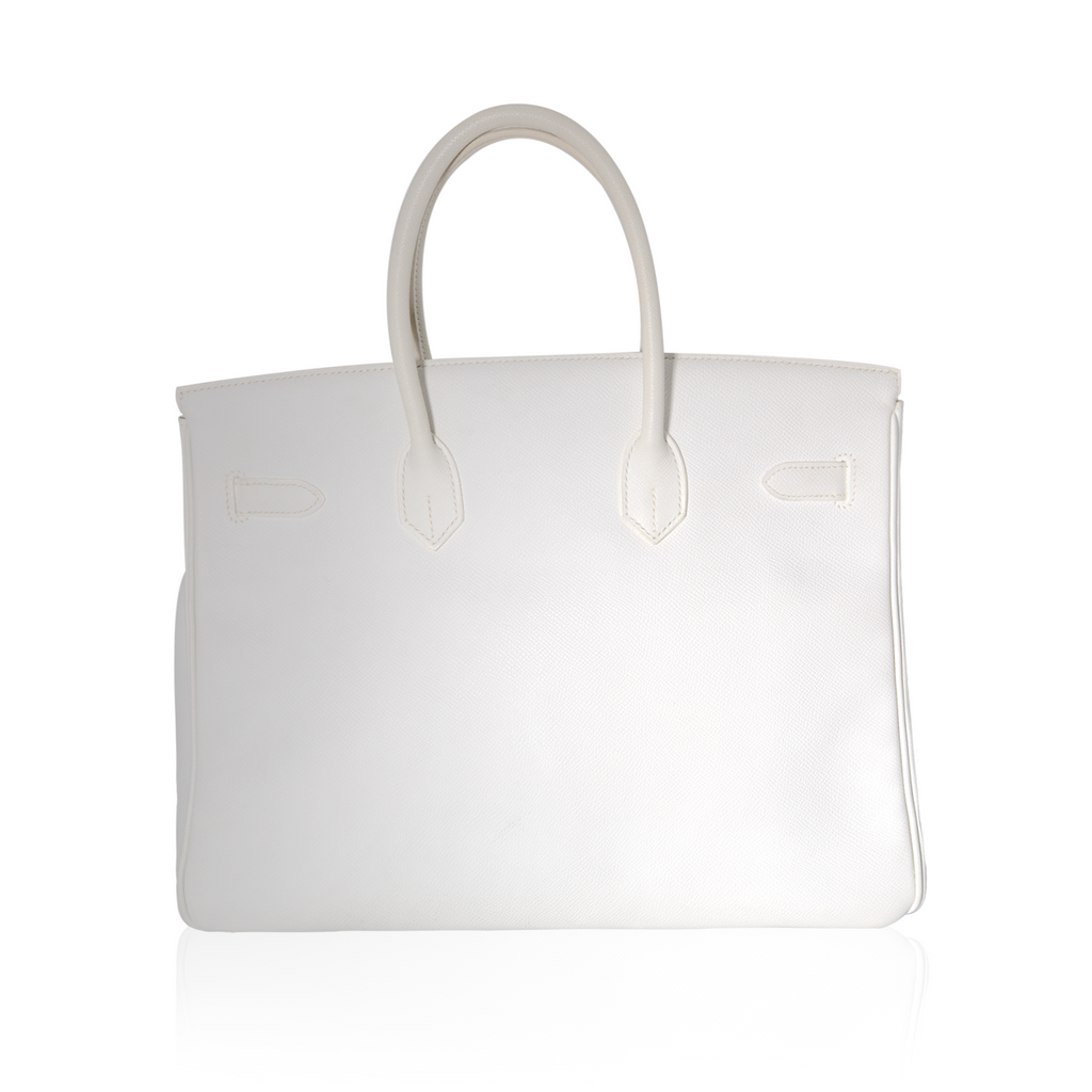Hermès Birkin 35 White Epsom Top Handle Bag with gold hardware, featuring structured design and rolled handles.