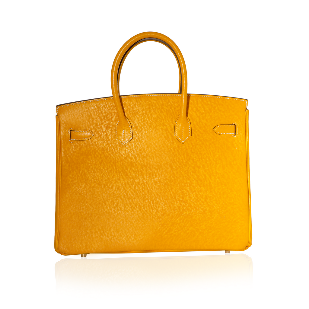 Hermès Birkin 35 Top Handle Bag in Jaune D'or and Potiron Candy Epsom leather, featuring structured design and gold-tone hardware.