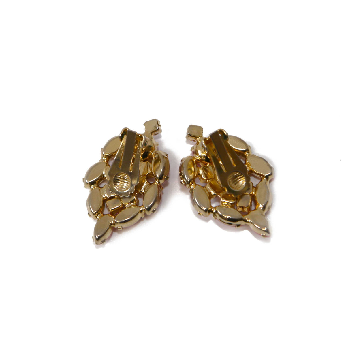 Pink crystal clip-on earrings from Vintage Finds featuring sparkling pink stones and elegant metal settings.