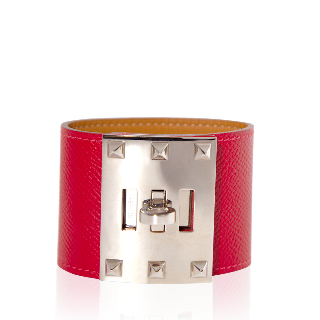 Hermès Kelly Dog Extreme bracelet in red Epsom leather with gold hardware, featuring a distinctive dog-shaped charm.