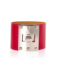 Hermès Kelly Dog Extreme bracelet in red Epsom leather with gold hardware, featuring a distinctive dog-shaped charm.