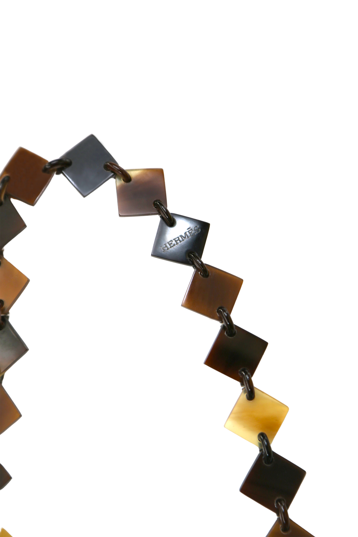 Hermès Brown Lacquer Lena Necklace showcasing a sleek, polished brown lacquer pendant on a delicate chain.