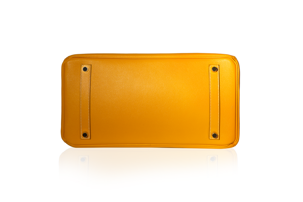 Hermès Birkin 35 Top Handle Bag in Jaune D'or and Potiron Candy Epsom leather, featuring gold-tone hardware and structured design.