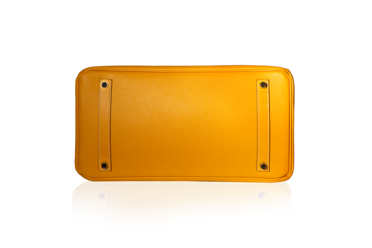 Hermès Birkin 35 Top Handle Bag in Jaune D'or and Potiron Candy Epsom leather, featuring gold-tone hardware and structured design.