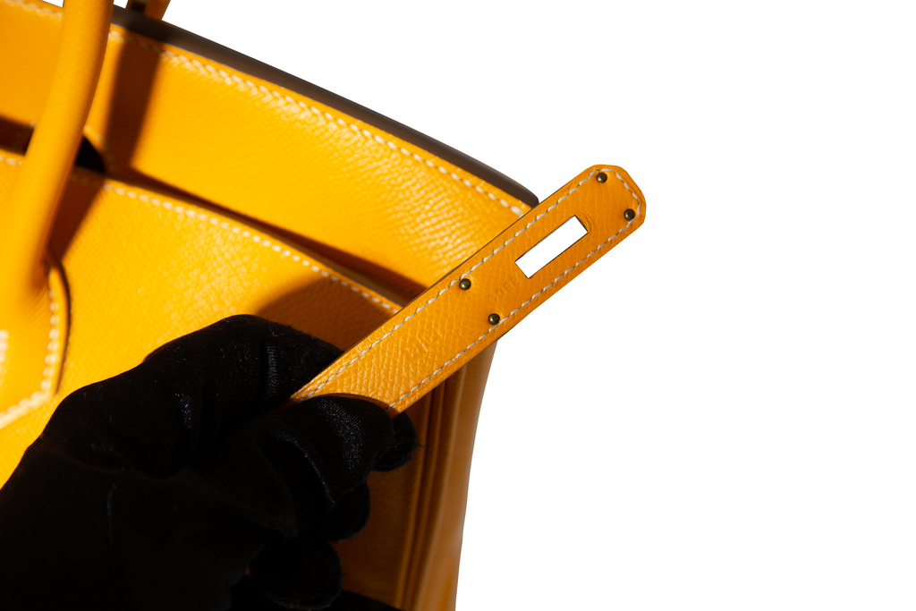 Hermès Birkin 35 Top Handle Bag in Jaune D'or and Potiron Candy Epsom leather, showcasing its vibrant color-block design.