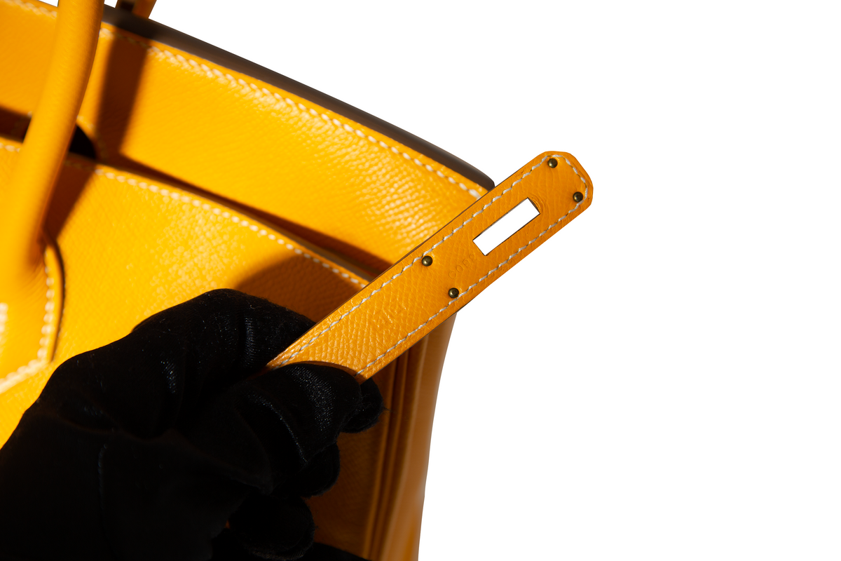 Hermès Birkin 35 Top Handle Bag in Jaune D'or and Potiron Candy Epsom leather, showcasing its vibrant color-block design.