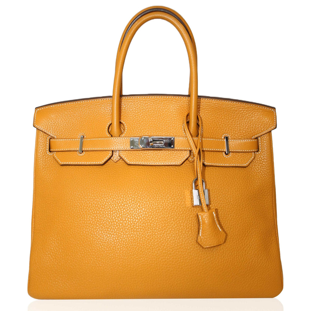 Hermès Birkin 35 Moutarde top handle bag in mustard leather, showcasing its elegant design and structured silhouette.